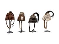 Seven Lega Headdresses and a Bamileke Quill Headdress
