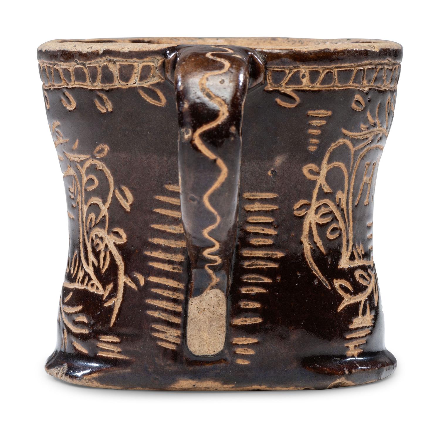 A Slip-Glazed and Incised Mug