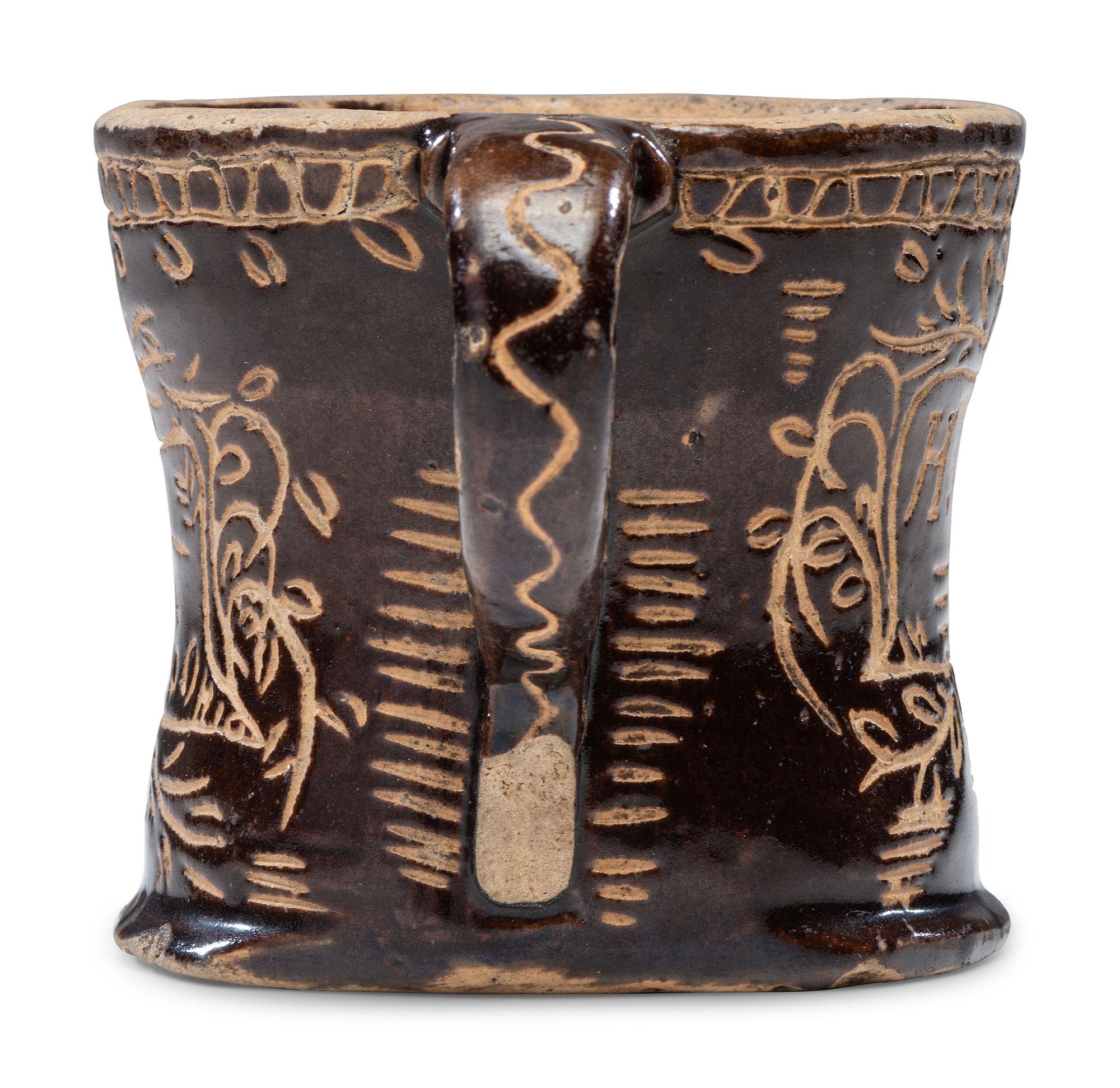 A Slip-Glazed and Incised Mug
