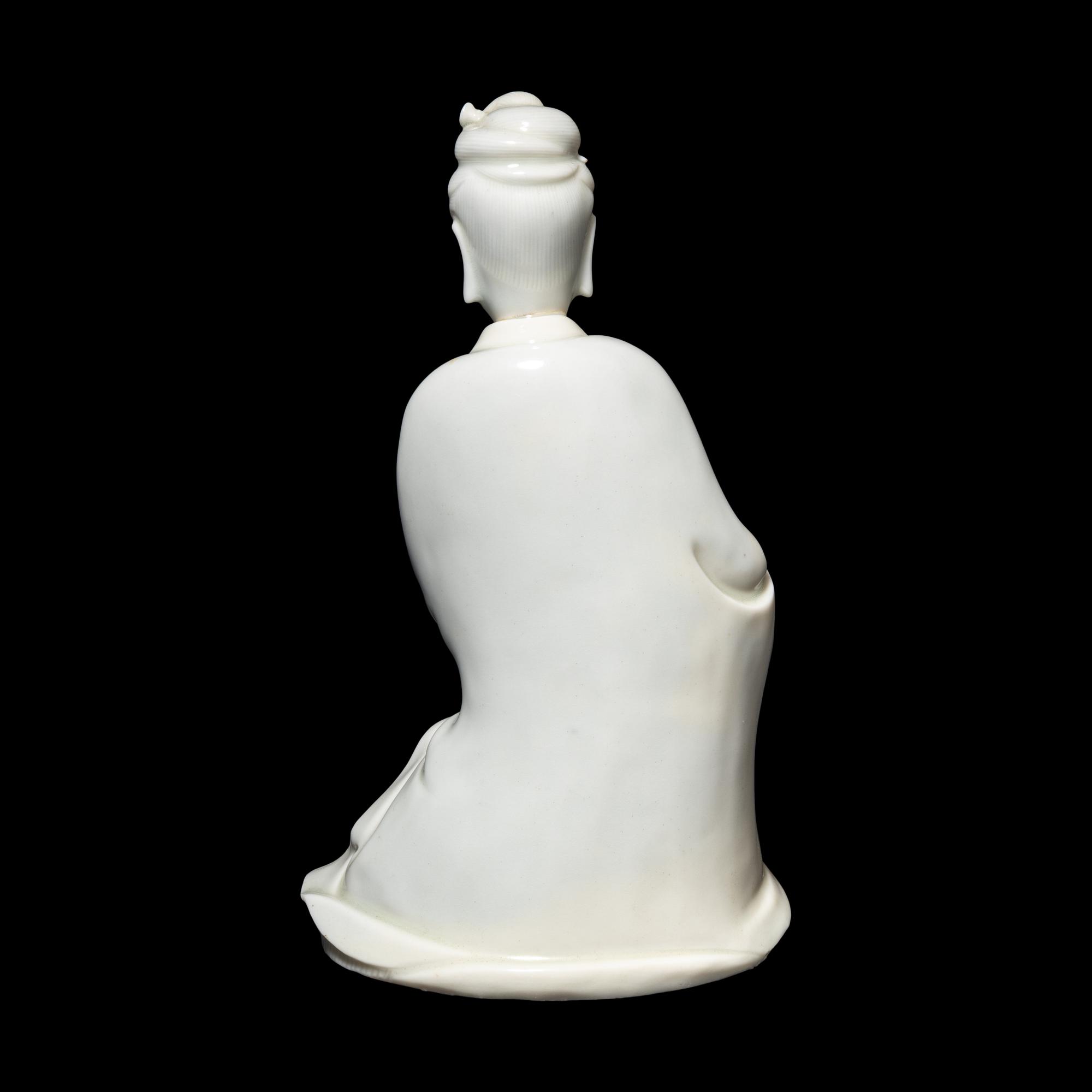 A Chinese Blanc-de-Chine Porcelain Figure of Guanyin, Late Qing/Republic Period 晚清/民國 德化白瓷書卷觀音