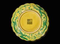 A green and yellow-glazed lobed "Dragon" dish, Qianlong mark 黃綠彩葵口龍紋小碟 乾隆款