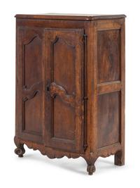 A French Provincial Carved Walnut Diminutive Armoire