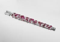 An Fine Art Deco Platinum, Diamond and Carved Ruby Bracelet, 30.80 dwts.