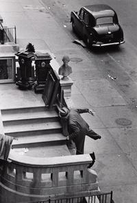 Ruth Orkin (1921-1985) Man Balancing on Stoop, West 88th Street, NYC, 1952