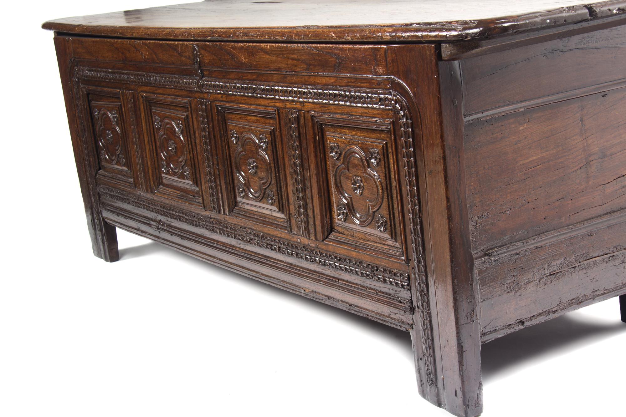 An Italian Oak Cassone Height 26 x width 71 x depth 22 3/4 inches.
