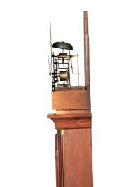 A Federal Carved and Inlaid, Brass-Mounted Mahogany Tall Case Clock