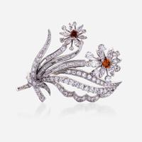 A diamond, colored diamond, and platinum brooch