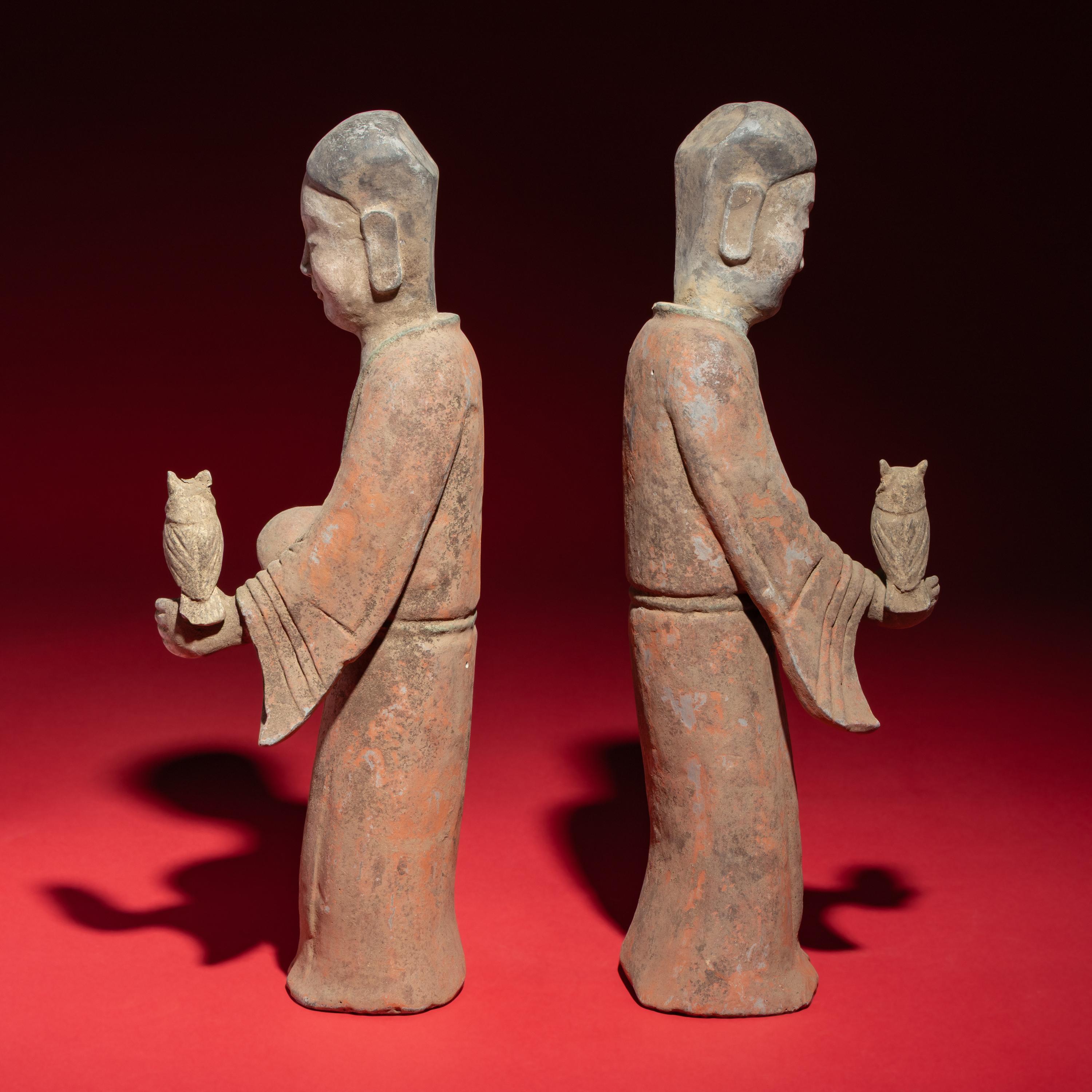 A Pair of Chinese Painted Grey Pottery Ladies with Owls, Han Dynasty — 漢 灰陶彩繪持鷹女俑一對