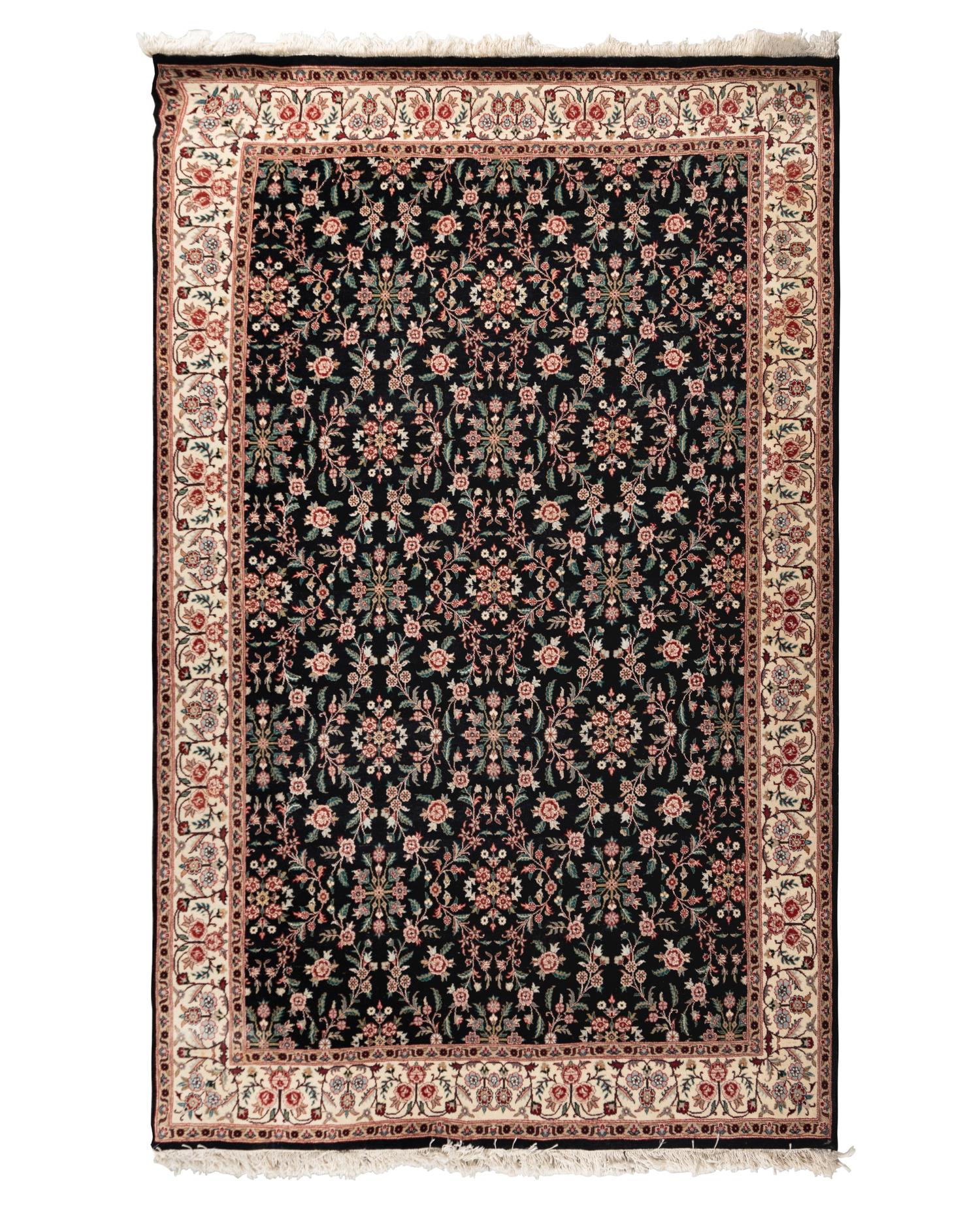 An Indo-Kashan Wool Rug