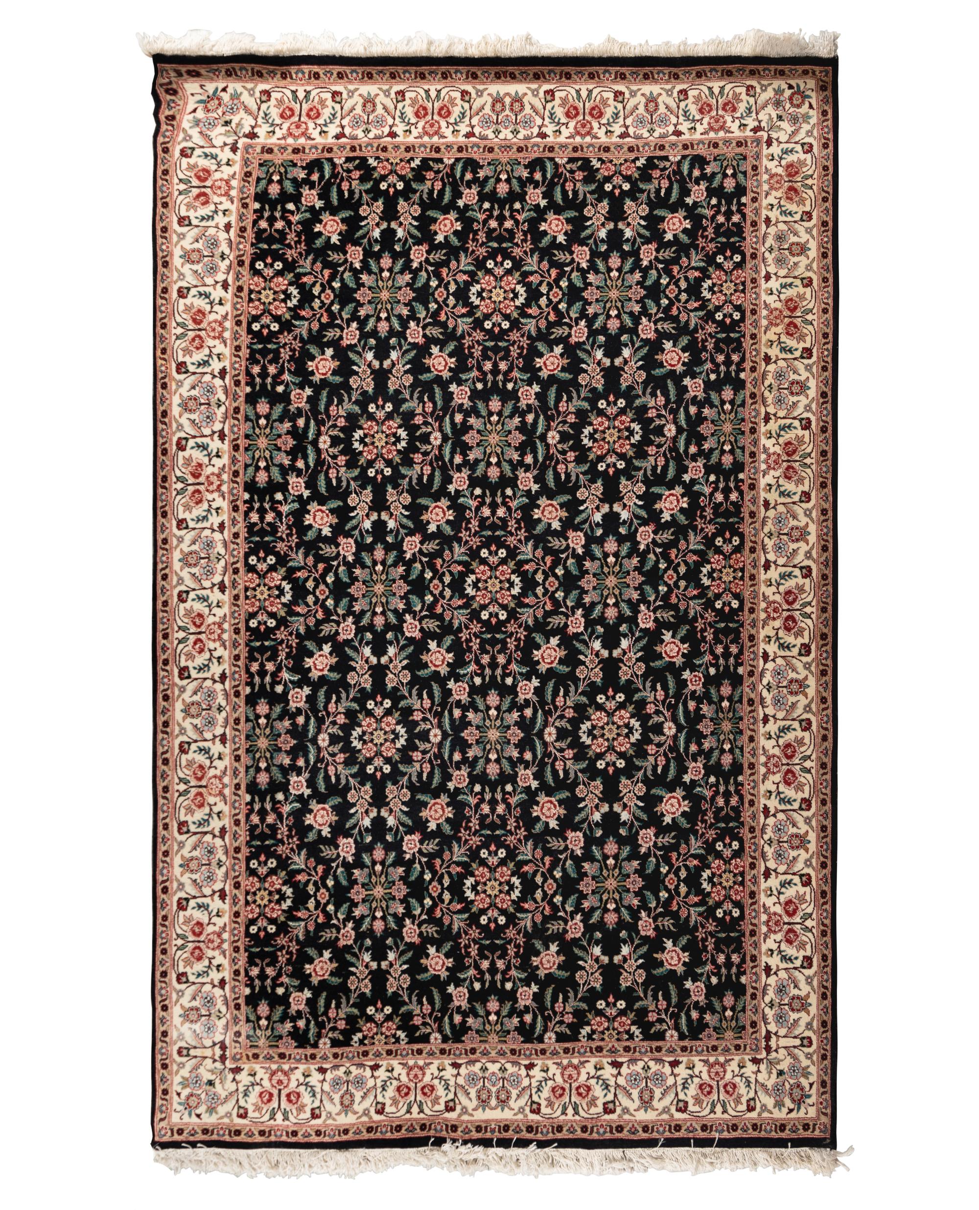 An Indo-Kashan Wool Rug