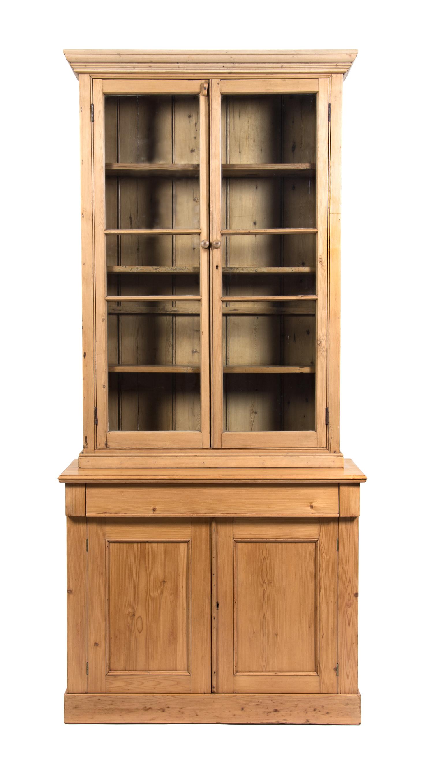 An Irish Pine Bookcase Height 77 x width 35 1/2 x depth 18 1/2 inches. — 20TH CENTURY