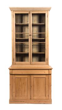 An Irish Pine Bookcase Height 77 x width 35 1/2 x depth 18 1/2 inches. — 20TH CENTURY