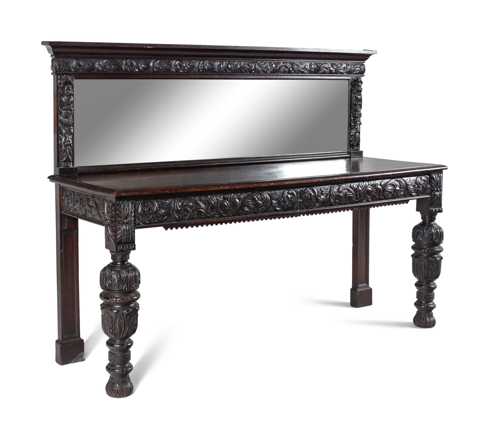 A Jacobean Style Carved Oak Sideboard and Mirror