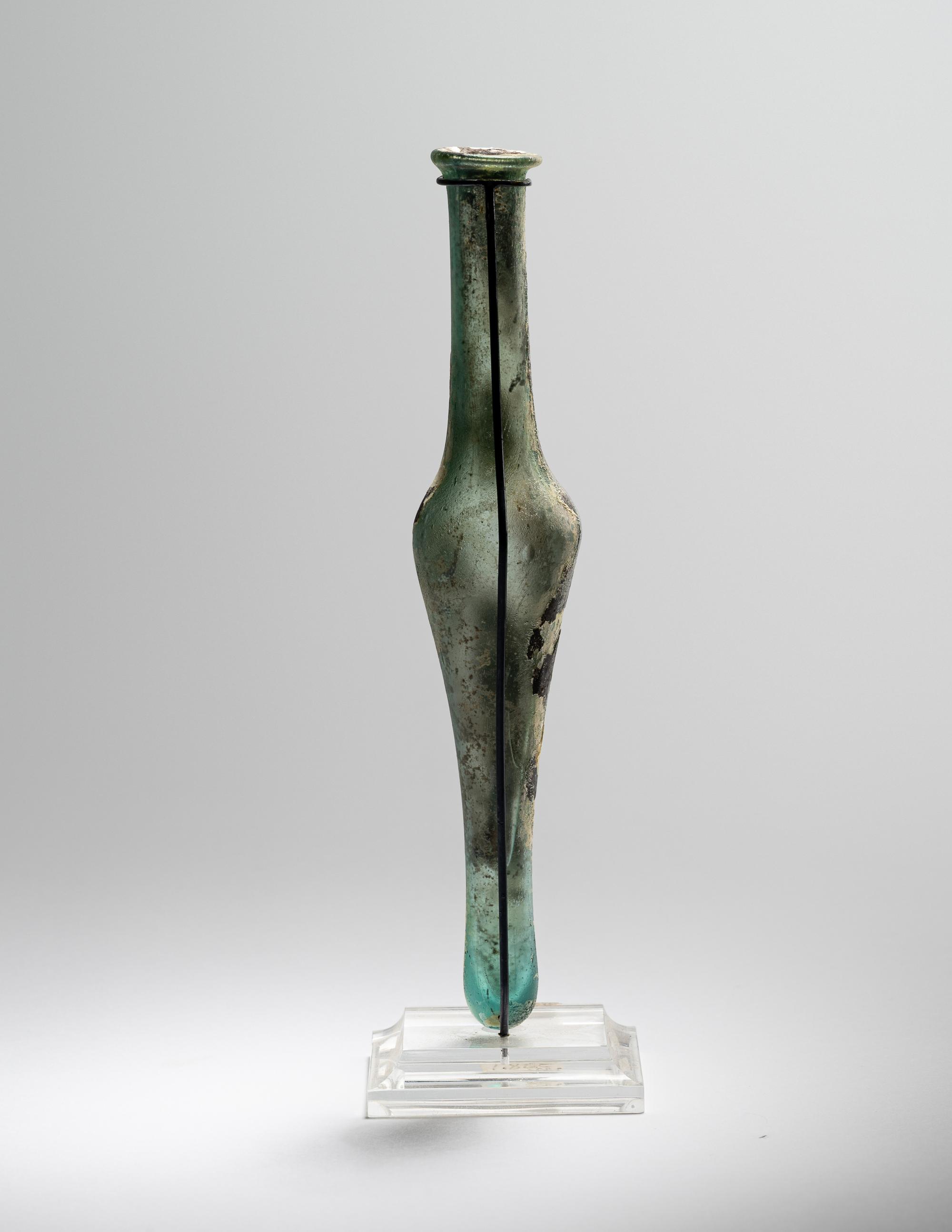 A Roman Pale Blue Glass Unguentarium