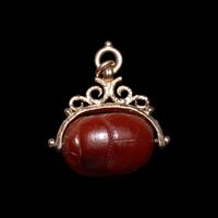 An Etruscan Carnelian Scarab with Warrior on Horseback and a Griffin — Set in a 19th Century gold swivel fob
