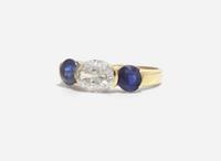 A Three-Stone Diamond and Sapphire Ring
