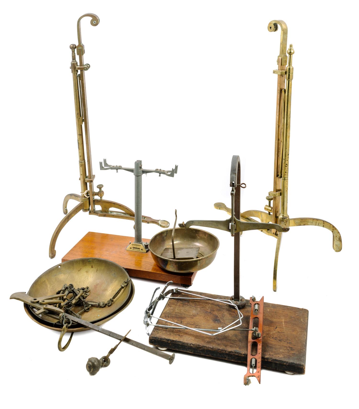 A Collection of Balance Scale Parts Height of tallest 27 1/4 inches.