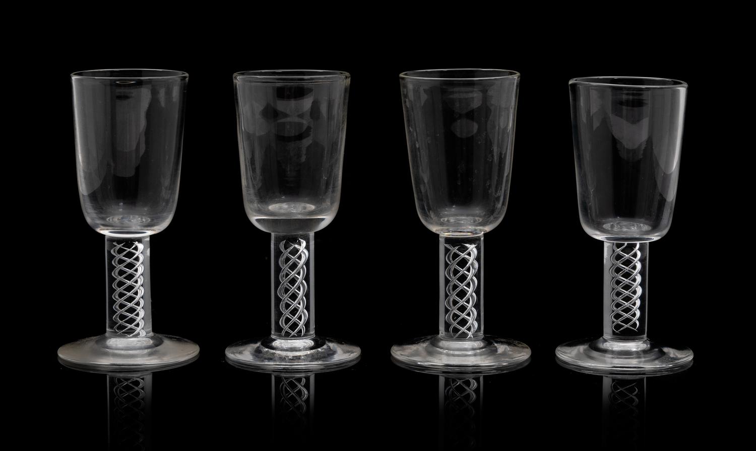 A Set of Eighteen Steuben Liqueurs Height 3 7/8 inches.