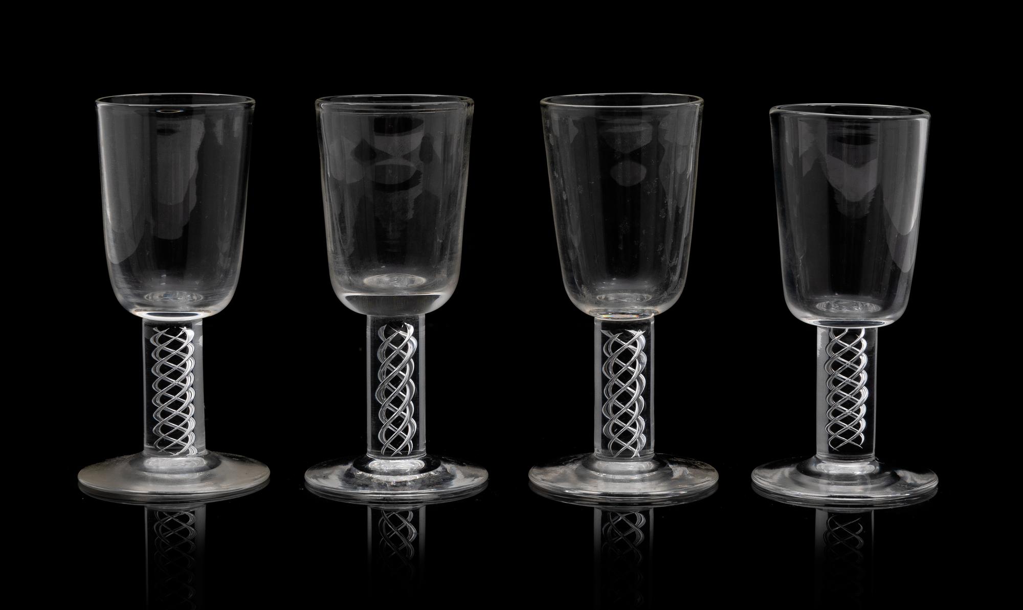 A Set of Eighteen Steuben Liqueurs Height 3 7/8 inches.
