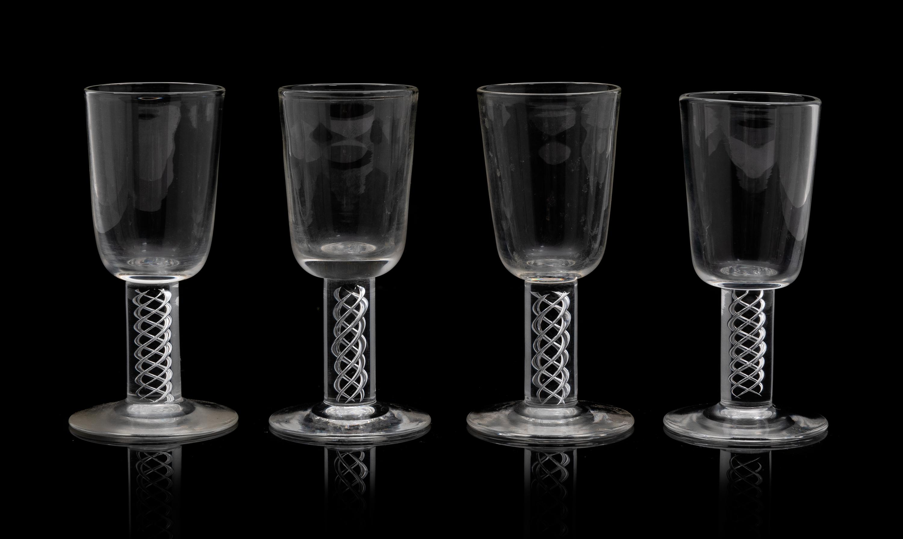 A Set of Eighteen Steuben Liqueurs Height 3 7/8 inches.
