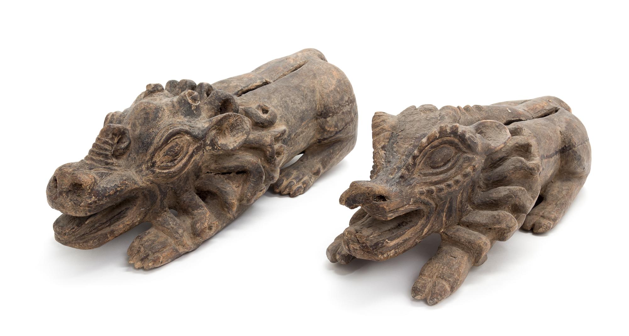 A Pair of Carved Wood Animal Figures Length of larger 20 inches.