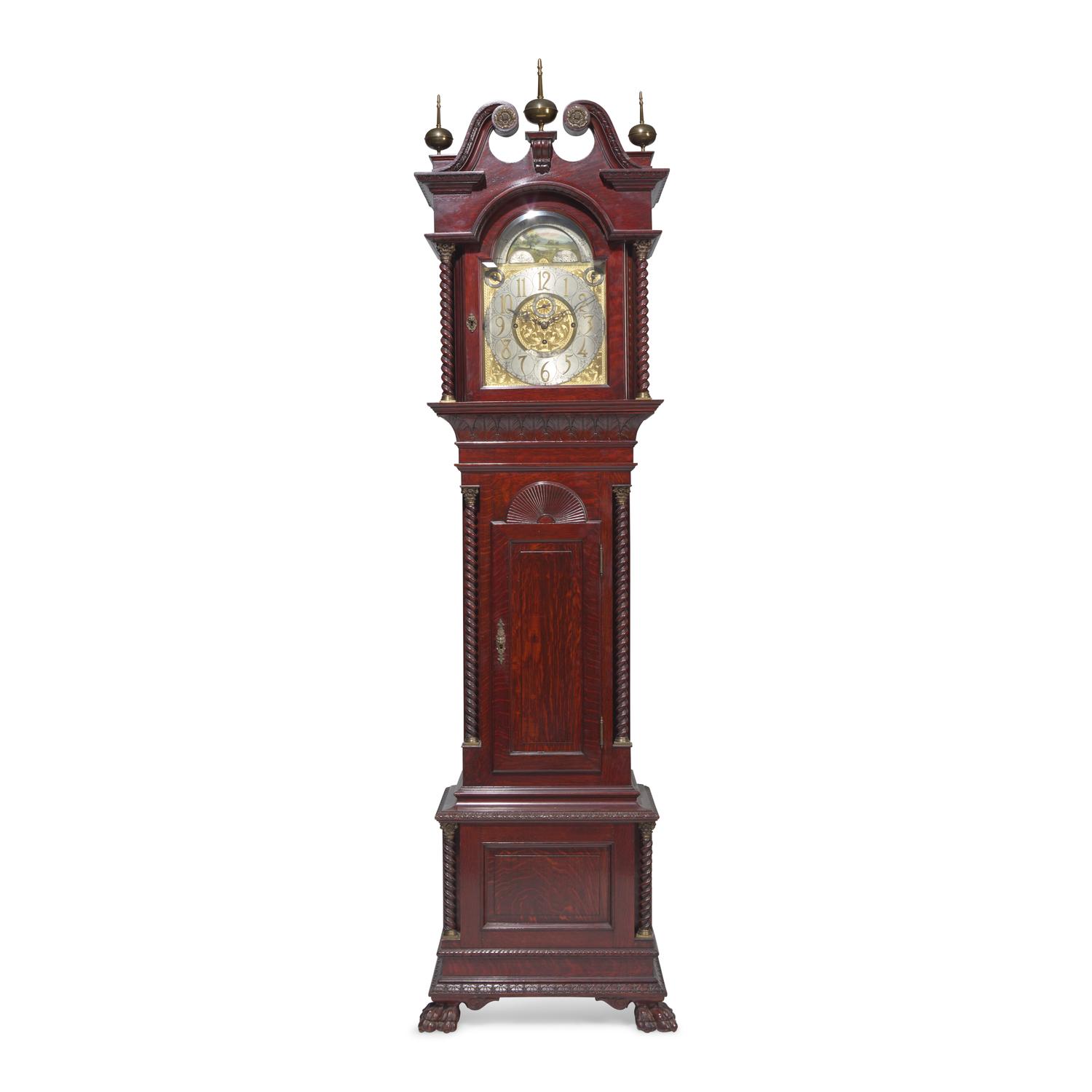 A Colonial Revival Carved Oak Tall Case Clock
