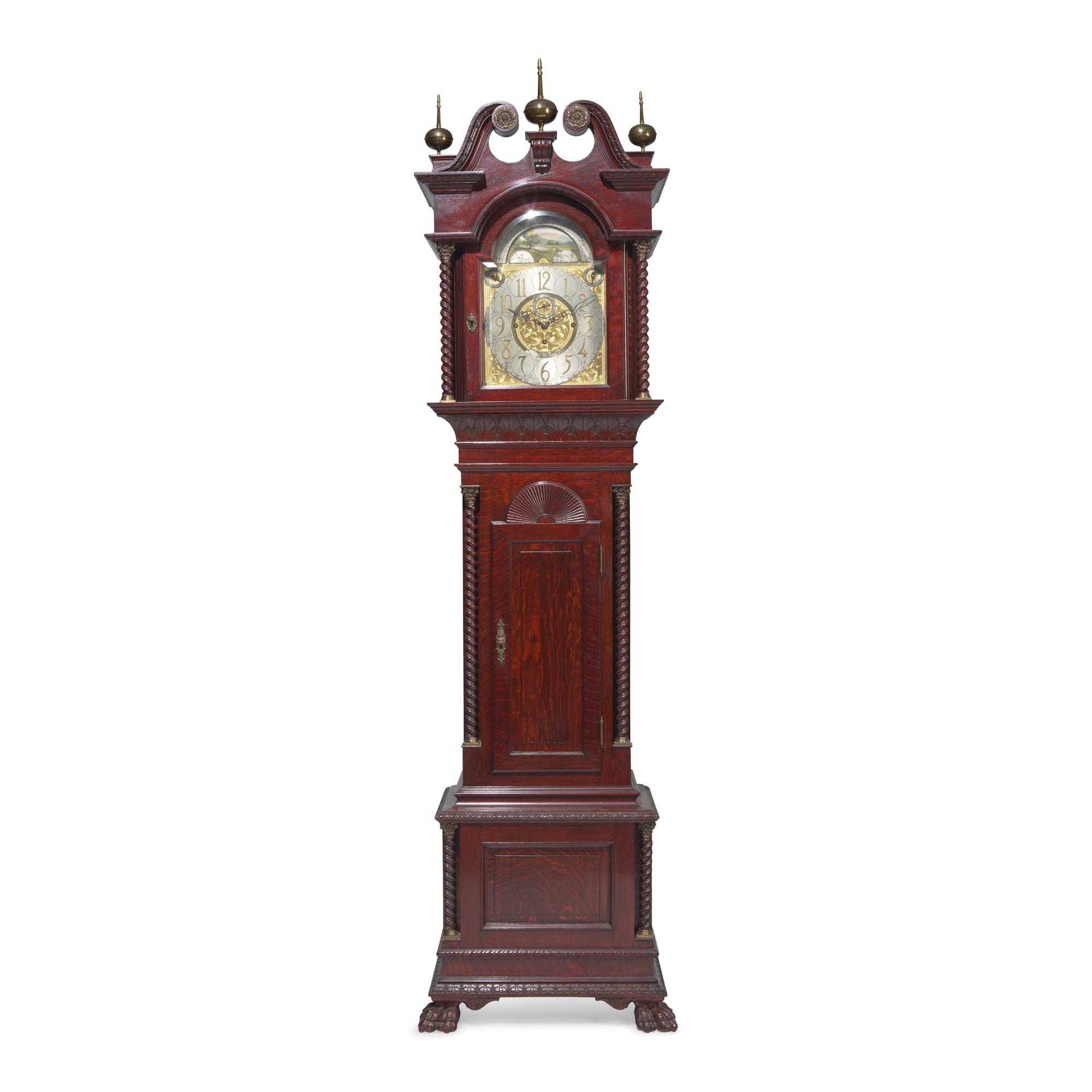 A Colonial Revival Carved Oak Tall Case Clock