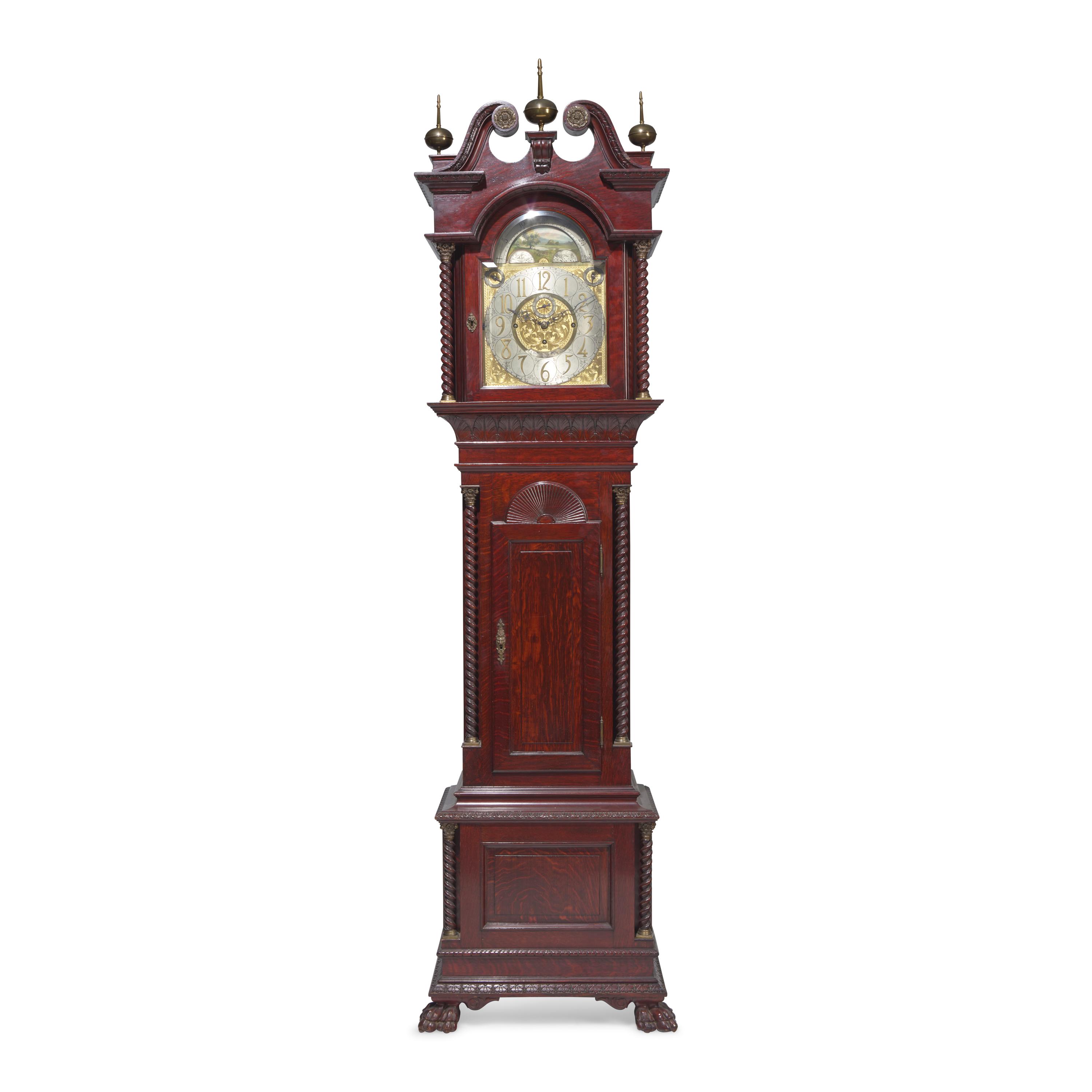 A Colonial Revival Carved Oak Tall Case Clock