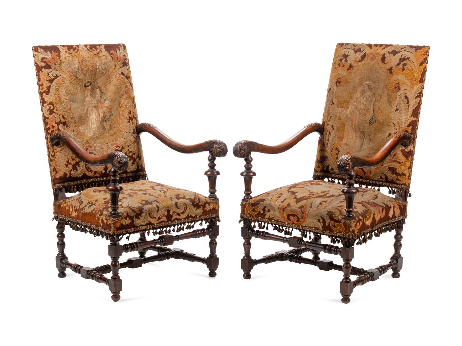 A Pair of William and Mary Style Carved Walnut Armchairs