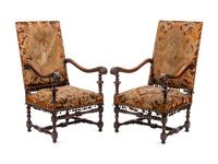 A Pair of William and Mary Style Carved Walnut Armchairs
