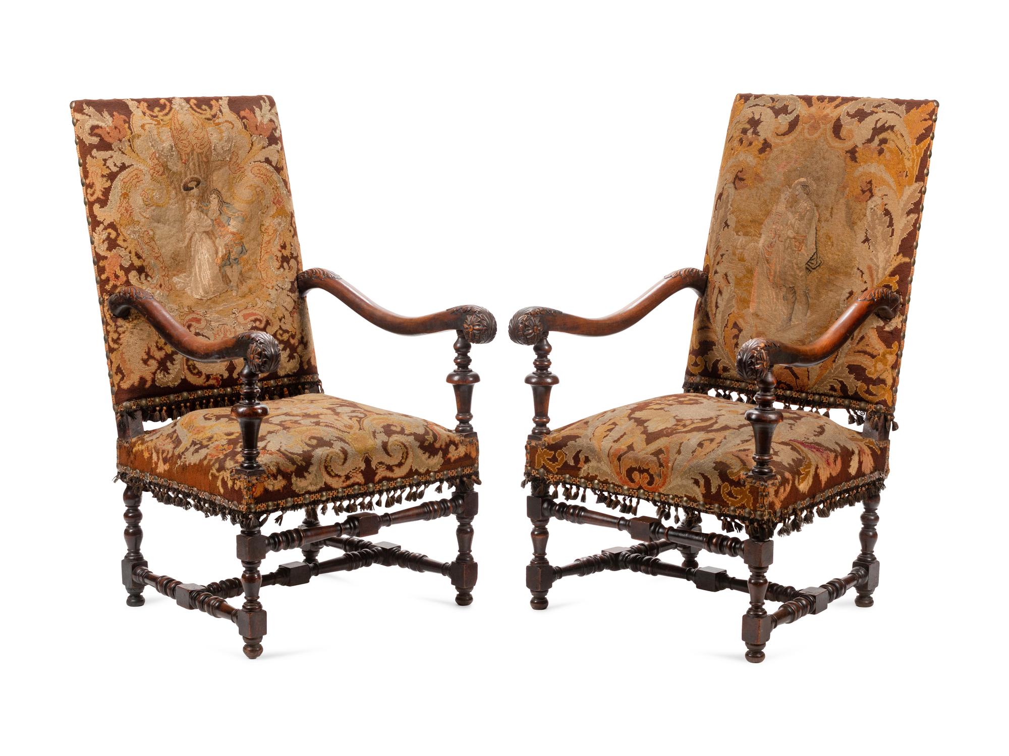 A Pair of William and Mary Style Carved Walnut Armchairs