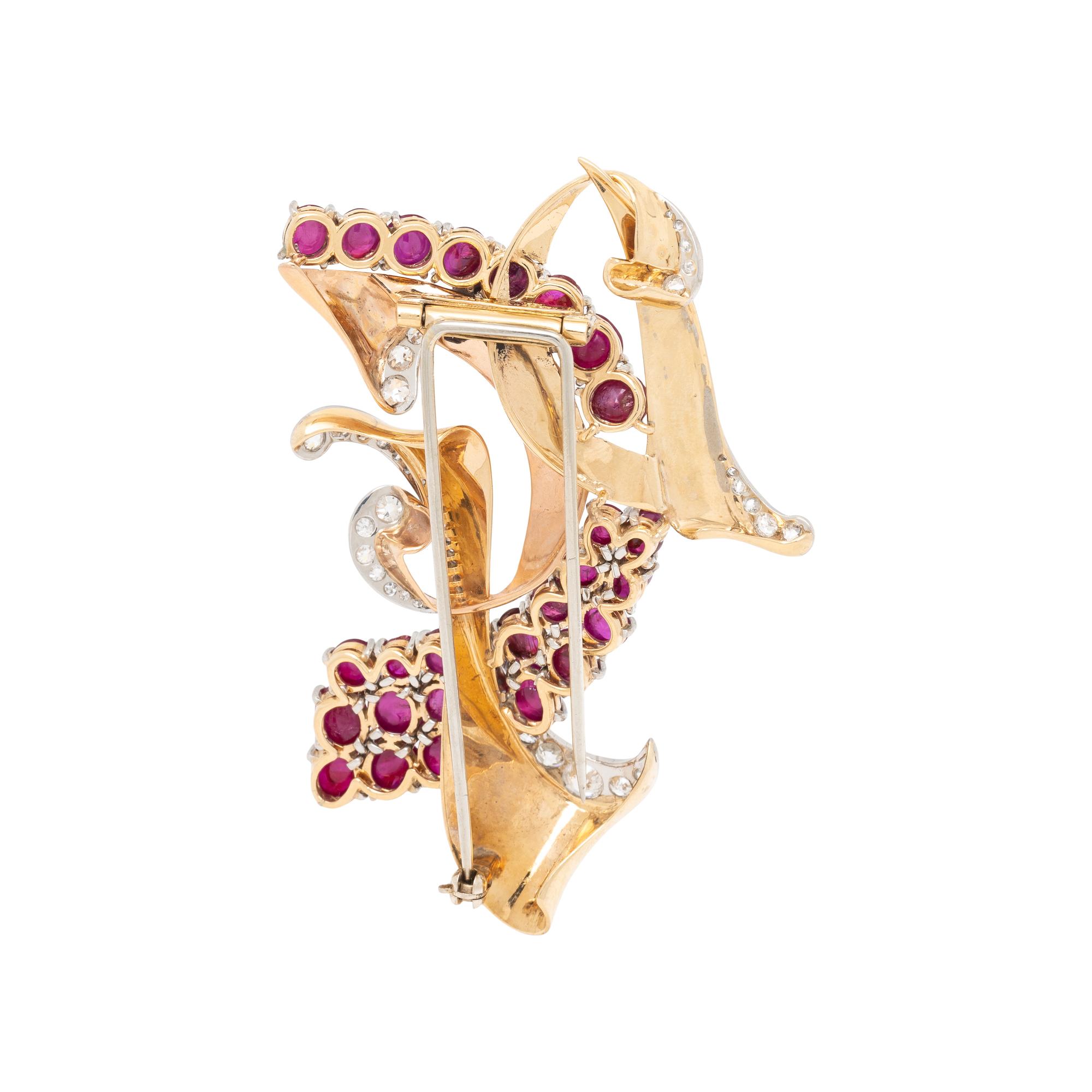 TRABERT & HOEFFER-MAUBOUSSIN, TRICOLOR GOLD, RUBY, AND DIAMOND 'REFLECTION' BROOCH