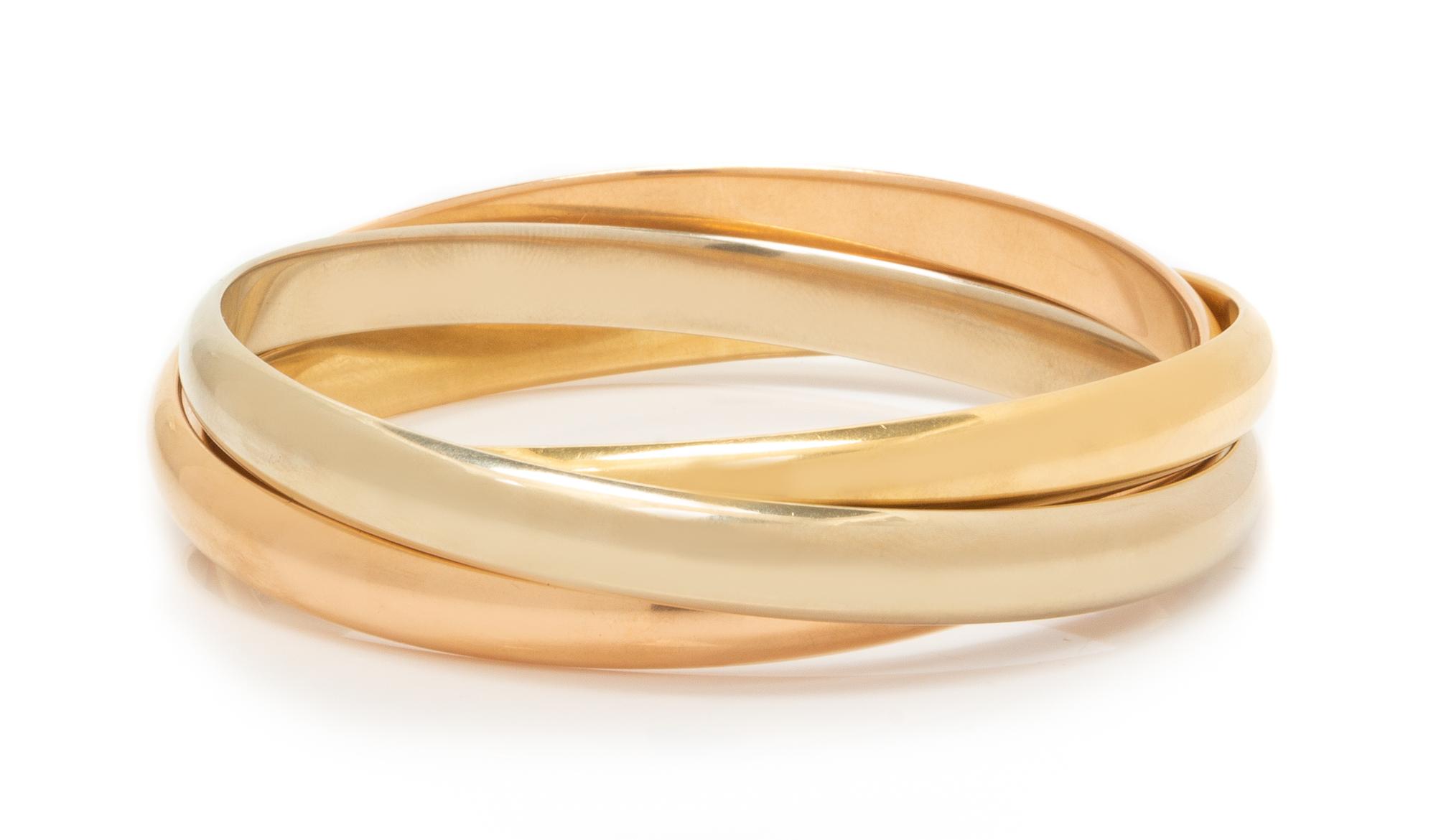 An 18 Karat Tricolor Gold Trinity Bangle Bracelet, Cartier, 57.00 dwts.