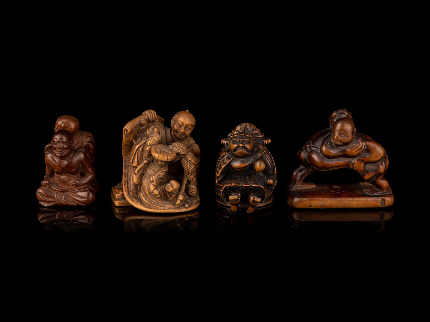 Four Japanese Carved Wood Figural-Form Netsuke