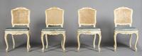 A Set of Four Louis XV Style Painted and Parcel Gilt Chairs, Height 36 1/2 inches.