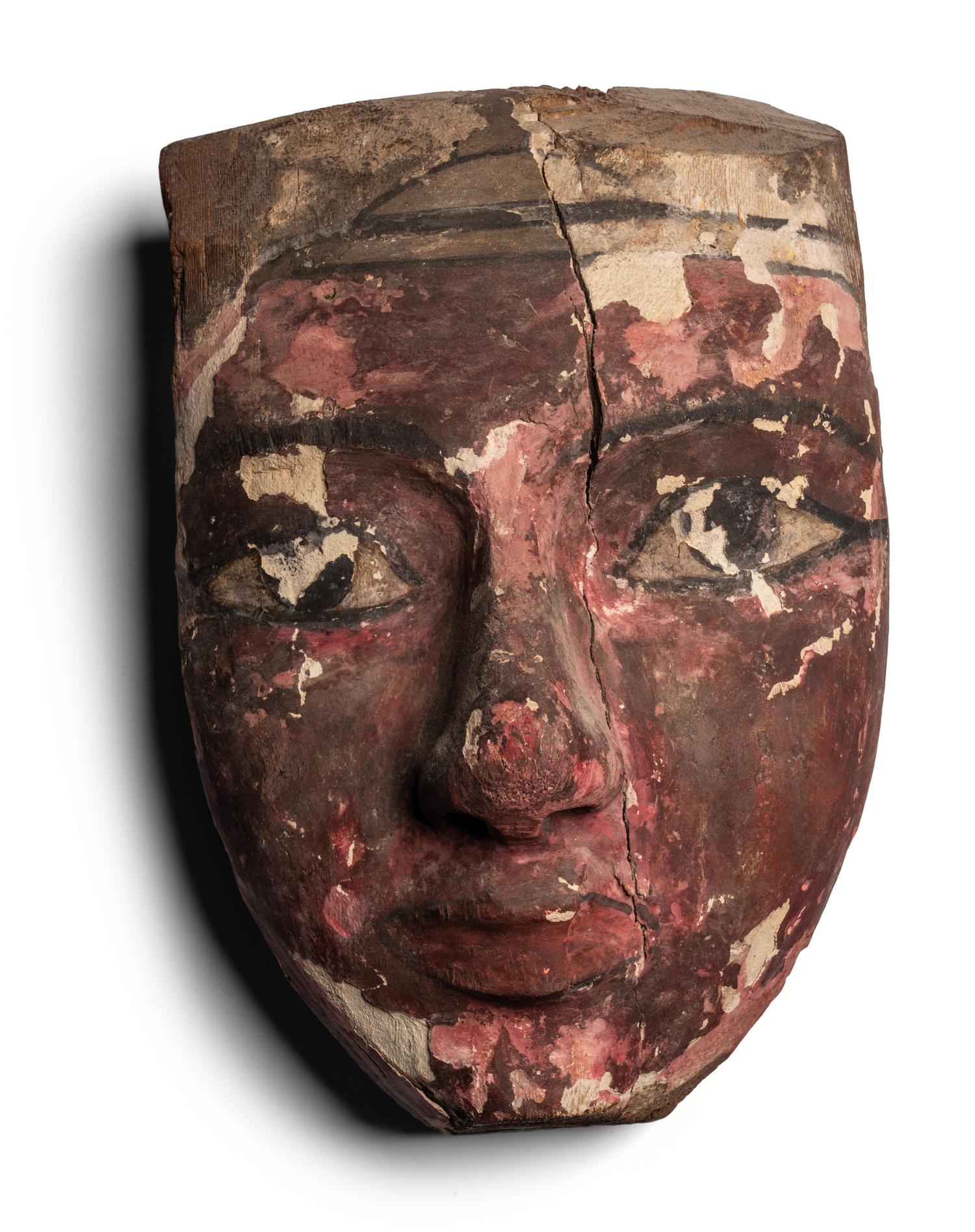 An Egyptian Painted Wood Mummy Mask