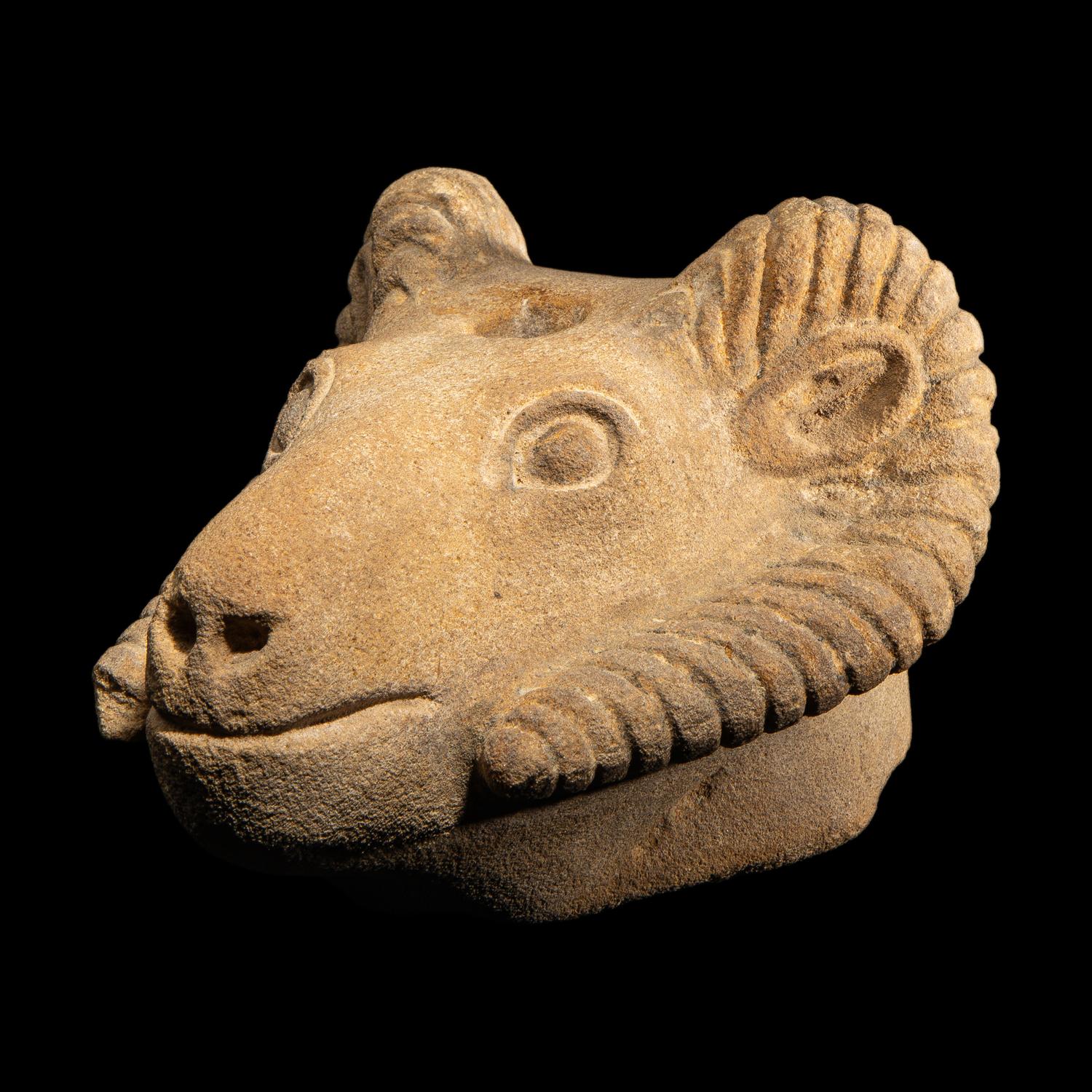 A Romano-Egyptian Style Sandstone Head of a Ram