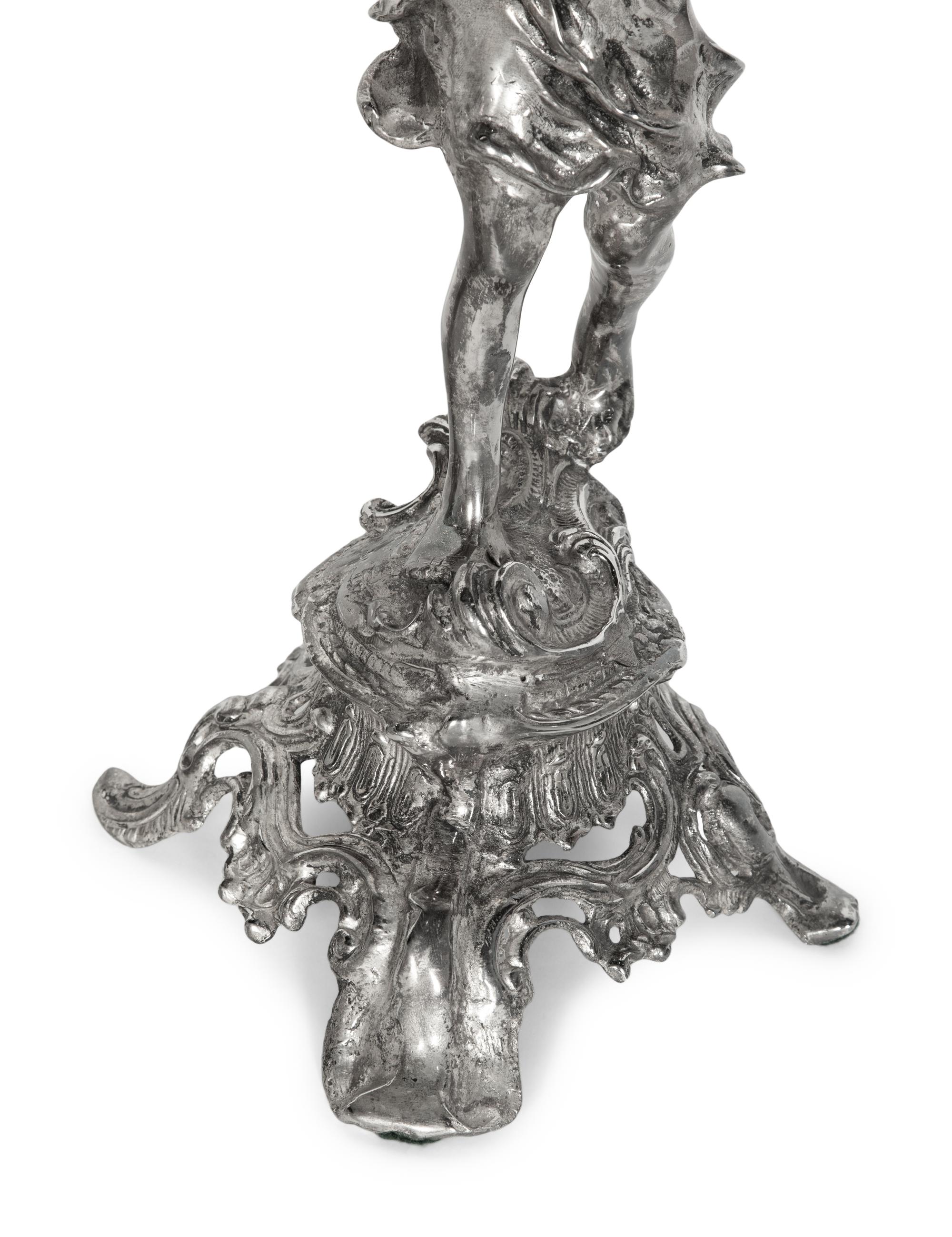 A Pair of Silvered Metal Figures