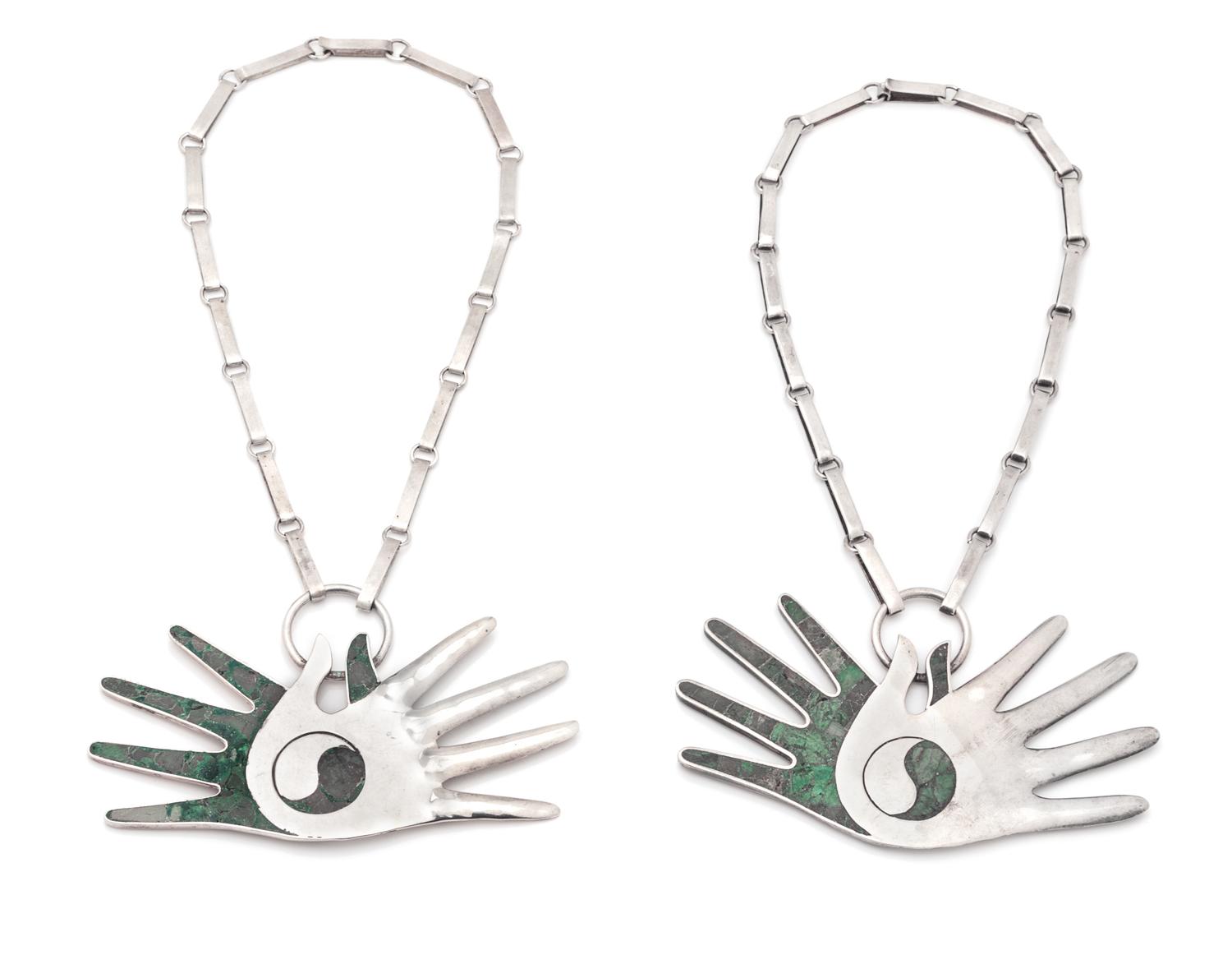 A Pair Sterling Silver and Turquoise Crossed Hands Necklaces, 116.00 dwts.