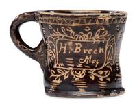 A Slip-Glazed and Incised Mug