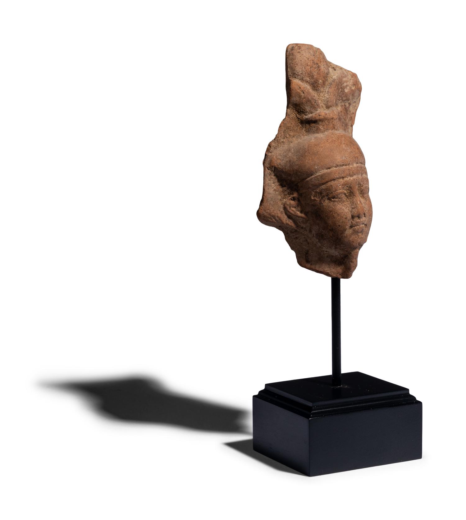 An Egyptian Terracotta Head of the God Osiris