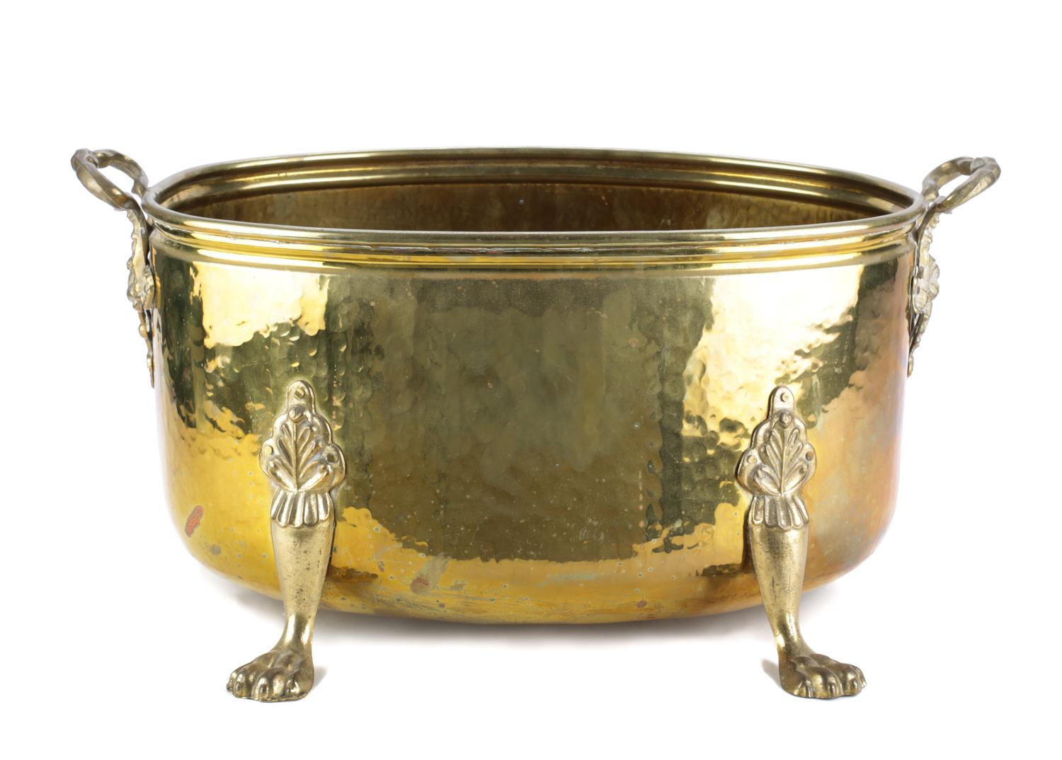An English Hammered Brass Footed Jardiniere Height 9 1/2 x width 19 1/2 x depth 11 1/2 inches. — 20TH CENTURY