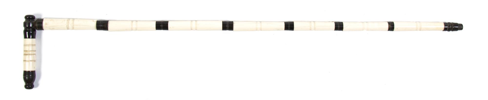 A Horn and Bone Veneered Cane, Height overall 35 x width of handle 5 3/4 inches.