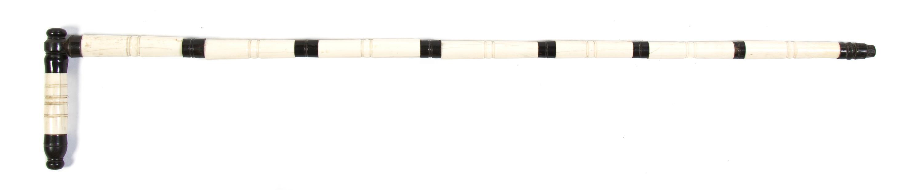 A Horn and Bone Veneered Cane, Height overall 35 x width of handle 5 3/4 inches.