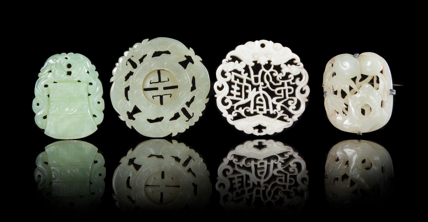 Four Jade Pendants Diameter of largest 2 1/4 inches. — 19TH CENTURY