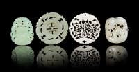 Four Jade Pendants Diameter of largest 2 1/4 inches. — 19TH CENTURY