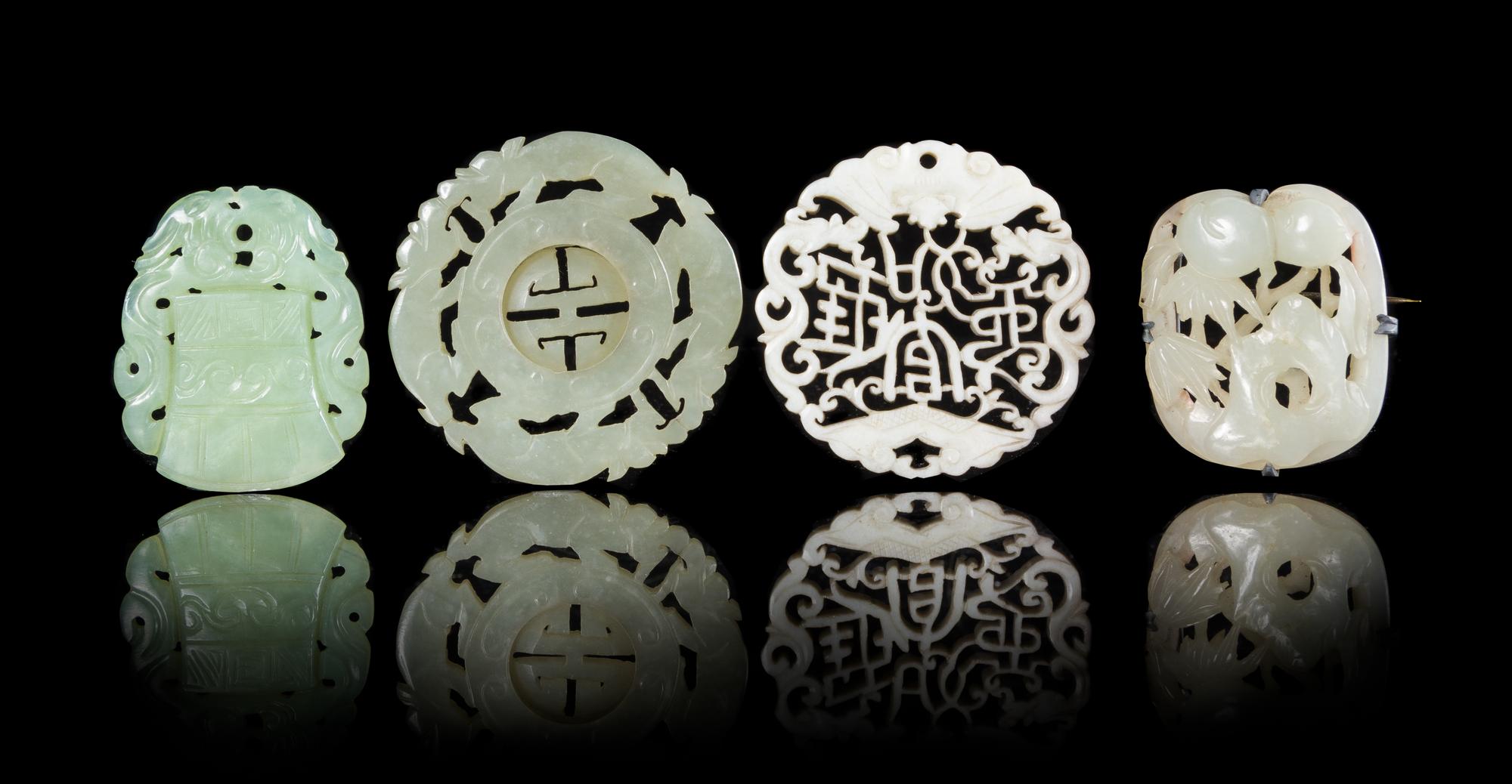Four Jade Pendants Diameter of largest 2 1/4 inches. — 19TH CENTURY