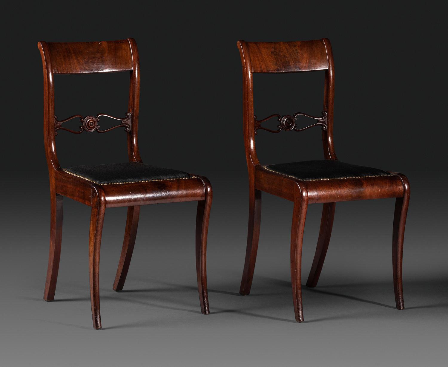 A Pair of Classical Figured and Carved Mahogany Klismos Side Chairs
