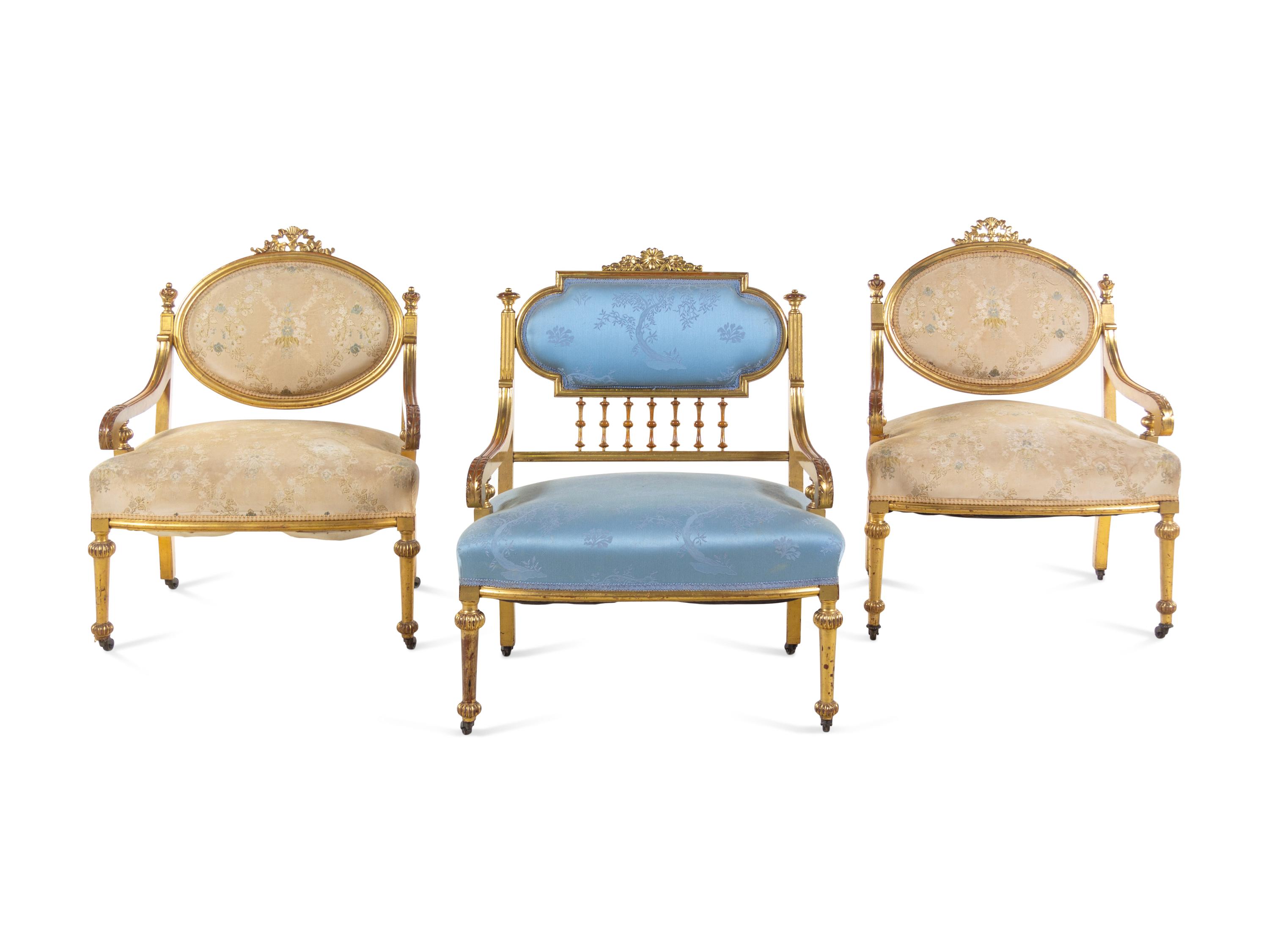 Three Louis XVI Style Carved Giltwood Fauteuils