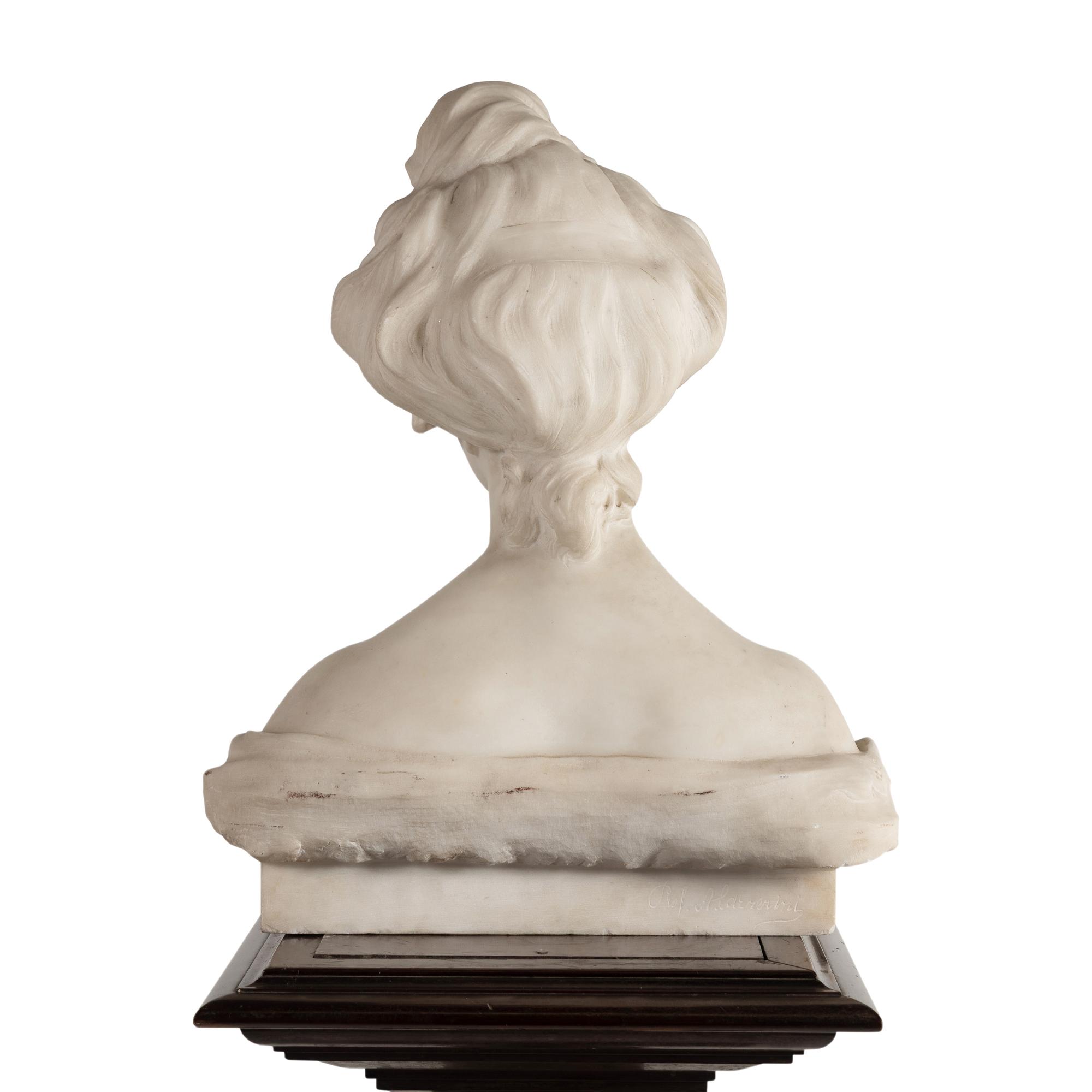 An Italian Carved Marble Bust of a Young Woman